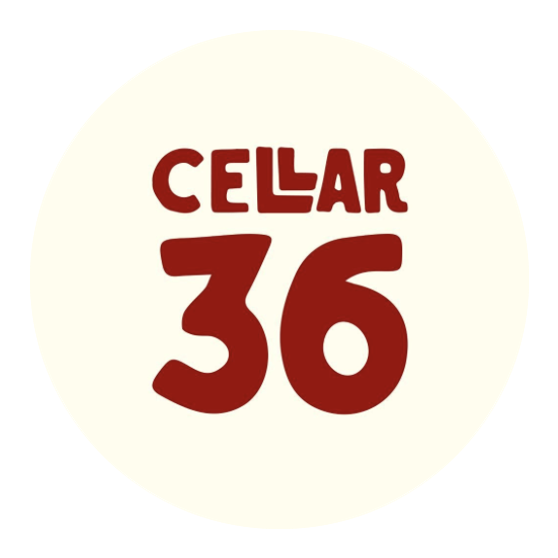 The Cellar36 wine bar logo. A cream colored circle with the word Cellar written in a maroon red font, all caps, and the number 36 below it in the same font and color.